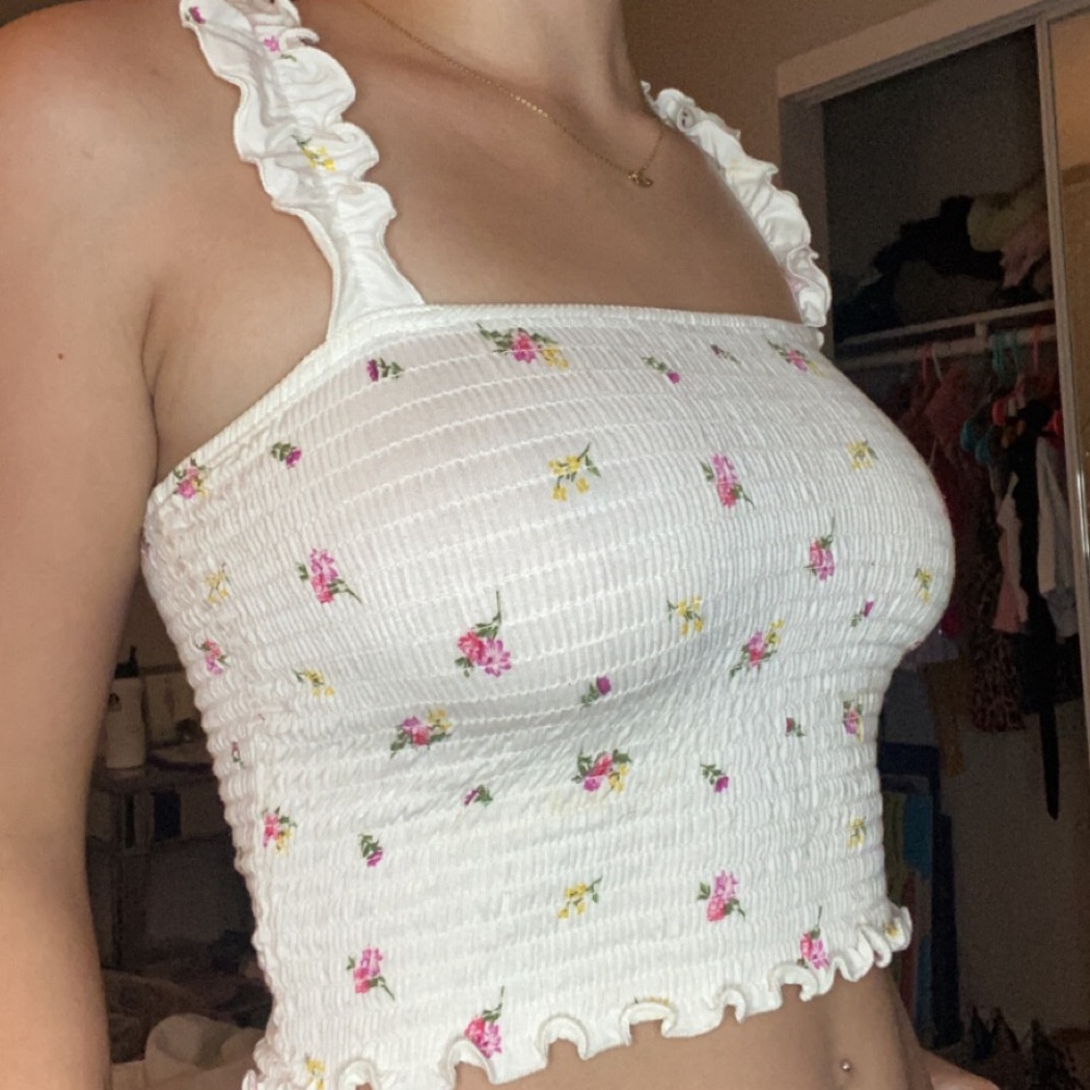 White and floral flirty tank